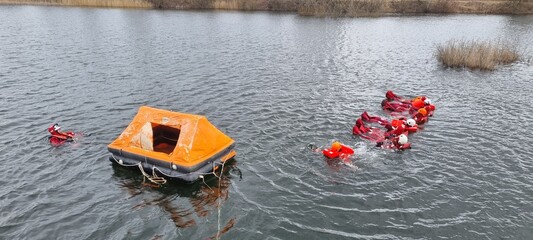 Delegates do practical exercises during a training session on Sea Survival