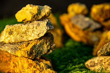 Stone texture background with green grass glowing orange