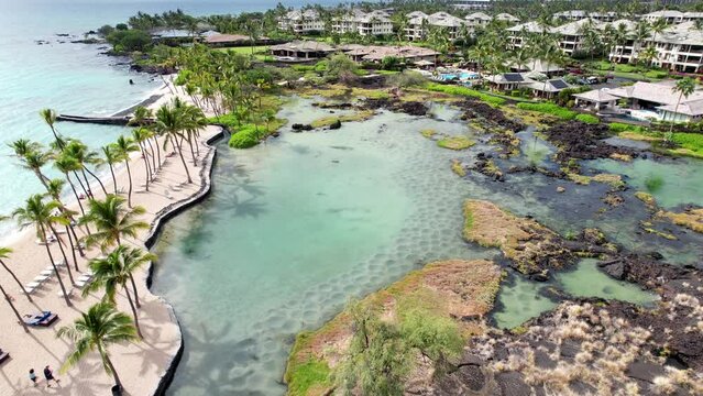 Drone shot flying over the coast of Kohala in Hawaii on sunny summer day