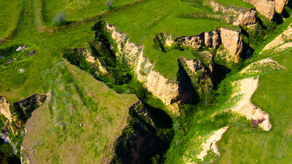 Canyon cliffs mountains green grass top view