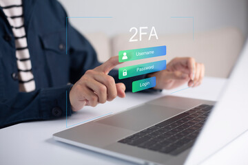 Businessman using laptop and touching virtual screen for two-factor authentication for safety use of social networks and access to information privacy