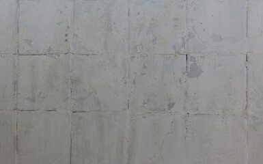 Old tiled wall background. Horizontal large brick tiles painted white. Abstract texture close up.