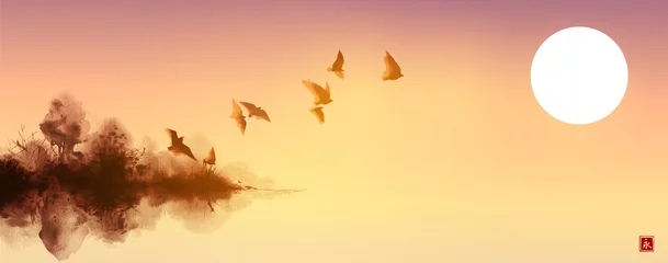 Fototapeten Tuschemalereilandschaft mit Vogelschwarm, der über der Insel mit Waldbäumen und Sonnenaufgangshimmel fliegt. Traditionelle japanische Tintenwaschmalerei Sumi-e © elinacious
