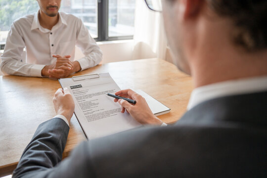 Executive or manager interviewing applicants. Talk about past work experience and competence in the position. resume or personal record
