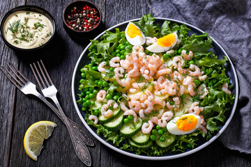 pink cocktail shrimps salad with veggies and eggs