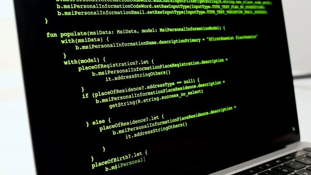Developer is browsing html code on the computer screen. Scroll of HTML Web Page Code. Programming code abstract technology background. Computer script concept. High quality 4k footage