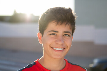 Frontal portrait of a smiling adolescent