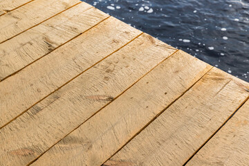 Edge of a wooden pier made of rough boards