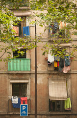 Fototapeta na wymiar different windows with hanging clothes