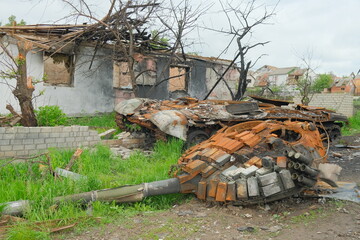 Russian battle tank remains with torn down gun turret