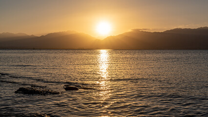 Sunrise view of Jordan from Eilat Israel across the Red Sea
