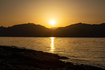 Sunrise view of Jordan from Eilat Israel across the Red Sea
