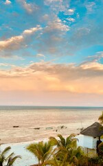 dhow boats by the beach at sunset