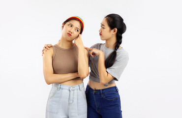 Photo of Two asian woman in lgbtq couple concept standing on the white background.