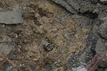 A hole in the ground from a cannon explosion of a Russian shell.