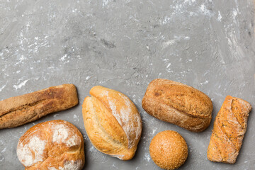 Homemade natural breads. Different kinds of fresh bread as background, top view with copy space