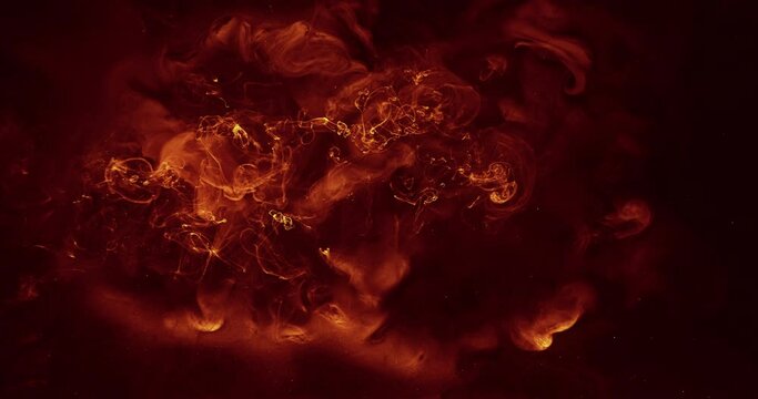 Ink water explosion effect. Orange fire flames. Abstract art background shot on Red Cinema camera 6k.