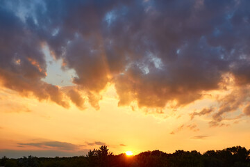 Obraz na płótnie Canvas Beautiful, heavy clouded blue sunset sky