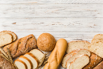 Homemade natural breads. Different kinds of fresh bread as background, top view with copy space