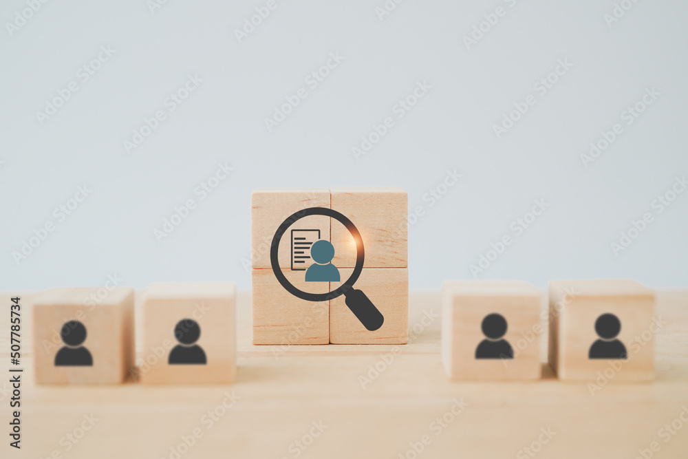 Wall mural wooden cube blocks with buyer information in magnifying glass ,buyer persona and target customer con