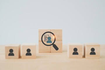 wooden cube blocks with buyer information in magnifying glass  ,buyer persona and target customer...