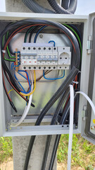 electricity distribution box with wires and circuit breakers fuse box. Selective focus.