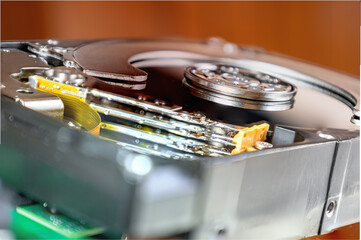 Detail lateral view of an opened hard disk