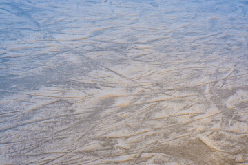 Ice texture on a skating rink. Winter background. Overhead view.