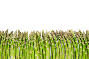 Green asparagus on white background. Fresh and tasty organic asparagus. Healthy food concept