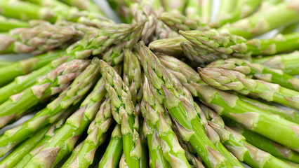 Asparagus. Green asparagus on a light table. Fresh and tasty organic asparagus
