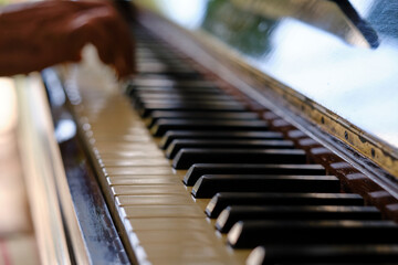 Close up of old piano keys and wood grains with sepia tone © Daniel