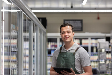 Portrait of grocery store sales assistant 