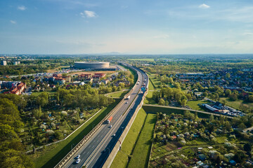 Aerial view of Wroclaw cityscape with residential districts, stadium and car traffic road