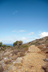 Paved stone path among the hills, Crete island, Greece.