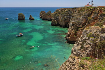 Sheer cliffs-tourist motorboats-eastern shore of Ponta da Piedade Point. Lagos-Portugal-275