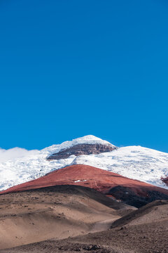 The top of the active Cotopaxi volcano with blue sky background, Cotopaxi National Park of Ecuador