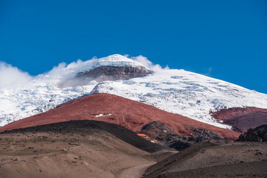 The top of the active Cotopaxi volcano with blue sky background, Cotopaxi National Park of Ecuador