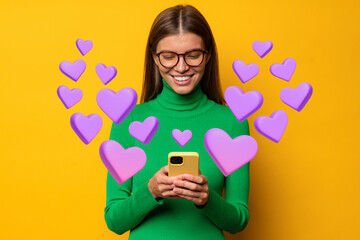 Happy girl sending love text message on smartphone with hearts flying away from screen