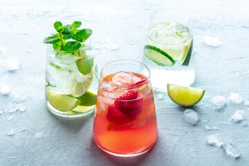 Summer cocktails. Cold drinks with fresh fruit. Healthy mocktails. Glasses of lemonade with ice