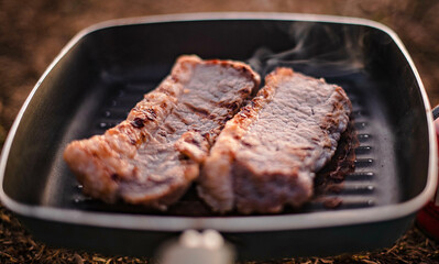 Make a steak on a small gas stove to take with you while camping in Mae Hong Son, Thailand. December 27, 2021