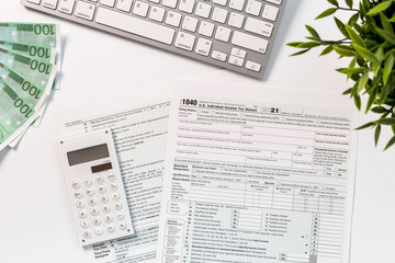 Naklejka na ściany i meble US tax form on businessman office table desktop, top view