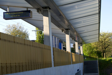 Modern golden railway station of City of Jona on a sunny spring day. Photo taken April 28th, 2022, Rapperswil-Jona, Switzerland.