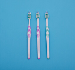 toothbrushes for oral hygiene on a light blue background