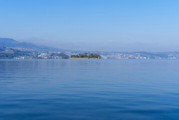 Fototapeta premium Scenic landscape with Lake Zürich seen from City of Rapperswil-Jona on a sunny spring day. Photo taken April 28th, 2022, Rapperswil-Jona, Switzerland.