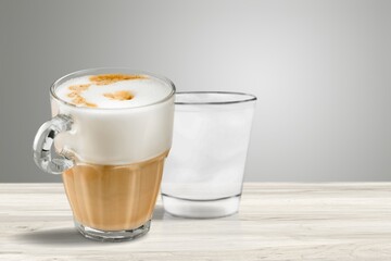 Hot aroma cup of coffee on desk board