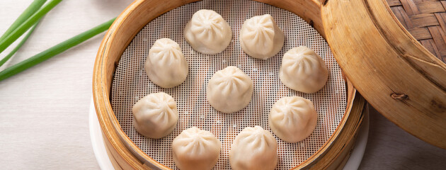 Fototapeta na wymiar Steamed pork soup dumplings named Xiao long bao in Taiwan.
