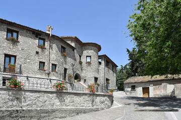 A narrow street between the old houses of Marsicovetere, a village in the mountains of Basilicata, Italy.