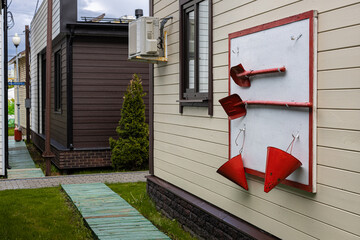   a tool designed to extinguish a fire hangs
