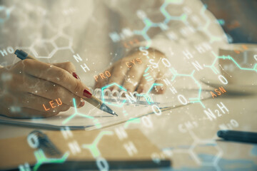 Science formula hologram over woman's hands taking notes background. Concept of study. Multi exposure