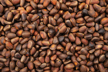 Pine nuts background. Cedar nutlets, close up.